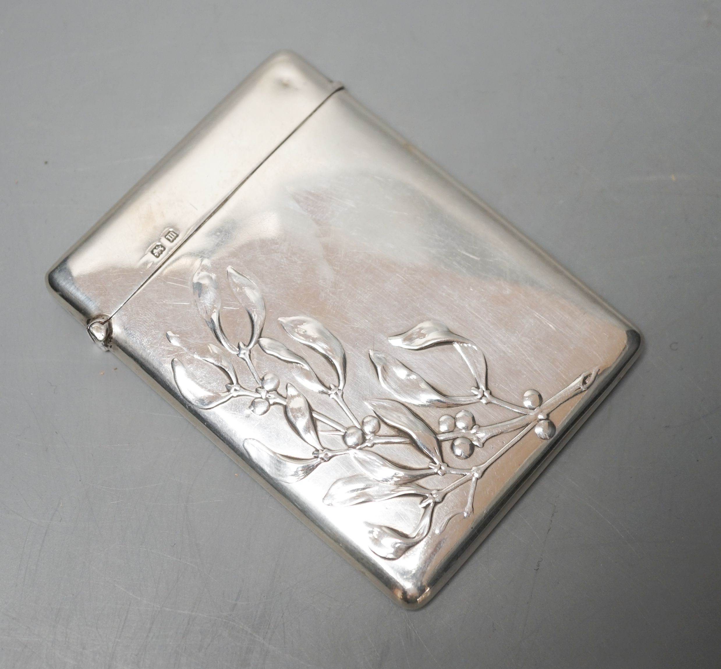 A George V silver card case embossed with mistletoe, Birmingham, 1911, 89mm.